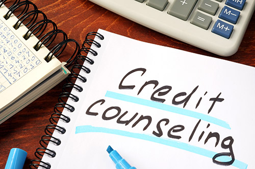 Credit counseling written in a note and calculator.